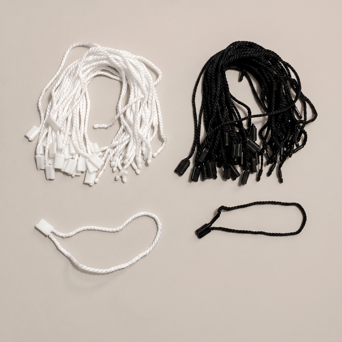 Black and white nylon hang tag strings with lock pin